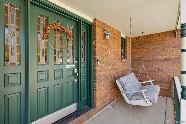 doorway to property with a porch