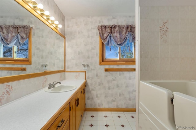 bathroom with vanity and a bath