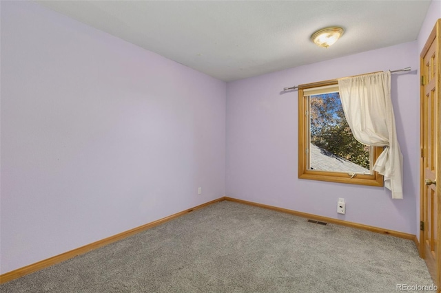 spare room with carpet flooring