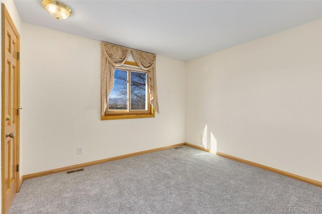 empty room featuring carpet floors