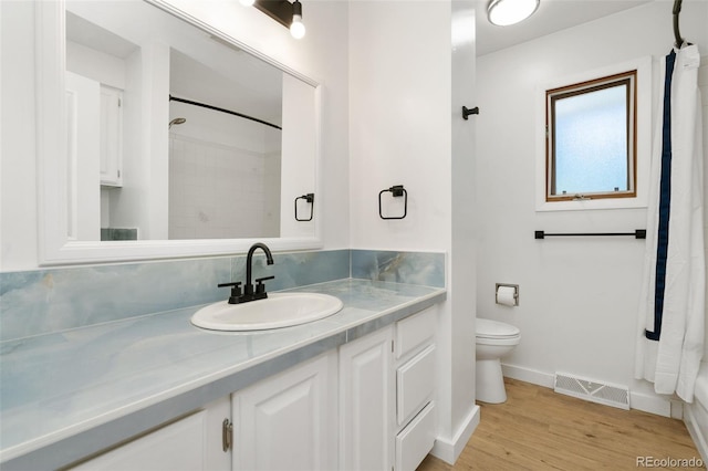 1304 S Lemay Ave, Fort Collins, CO 80524 - full bathroom featuring vanity, a shower with curtain, and wood finished floors