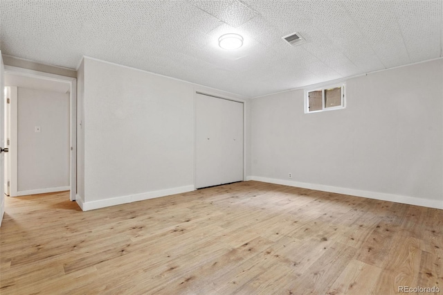 1304 S Lemay Ave, Fort Collins, CO 80524 - unfurnished bedroom featuring a closet, wood finished floors, and a textured ceiling