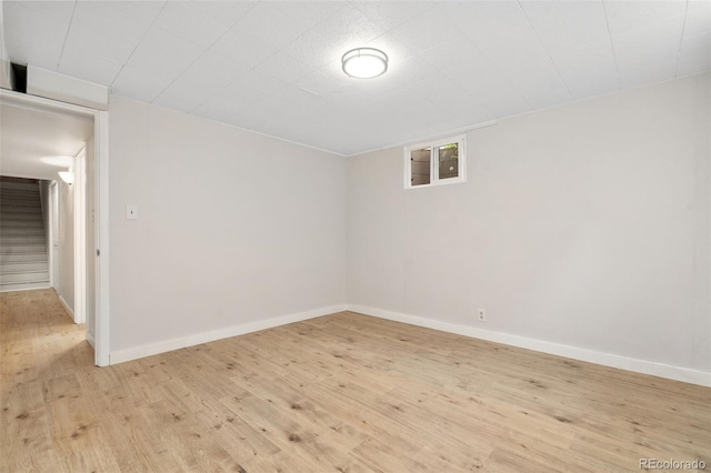 1304 S Lemay Ave, Fort Collins, CO 80524 - empty room featuring light wood-style flooring and stairway