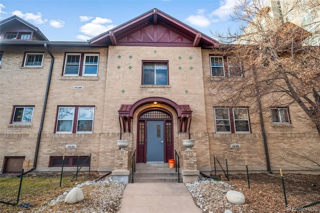 multi unit property with entry steps and brick siding