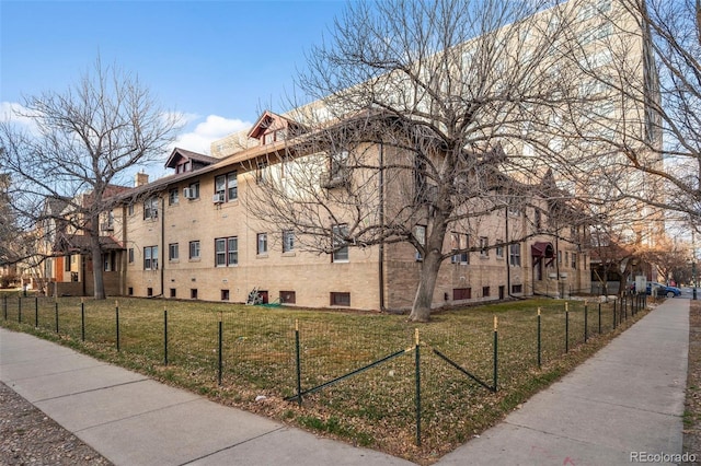 view of property featuring a fenced front yard