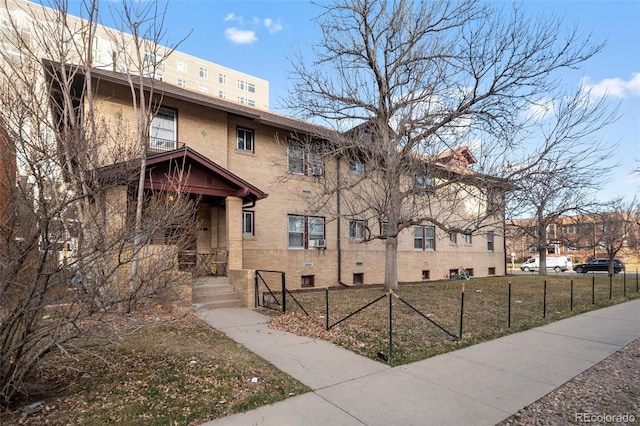 view of building exterior featuring fence