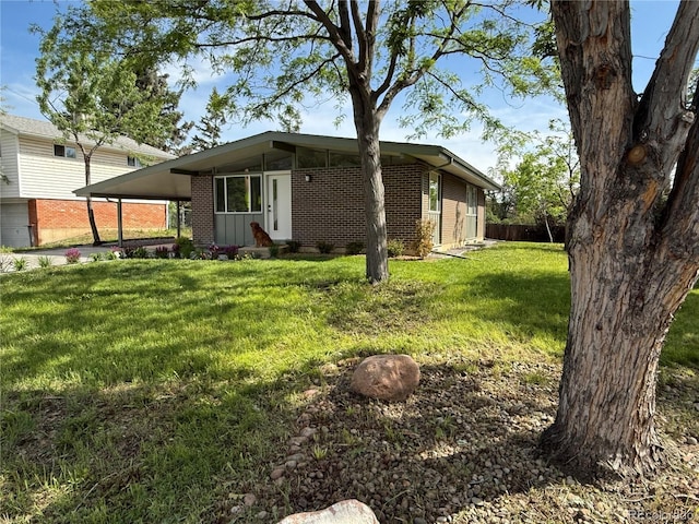 3355 Moorhead Ave, Boulder, CO 80305 - view of front of property with brick siding and a front lawn