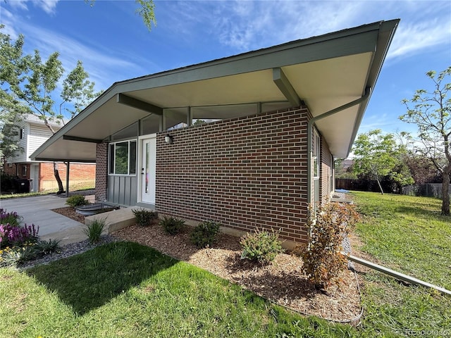 3355 Moorhead Ave, Boulder, CO 80305 - view of side of property with brick siding and a yard