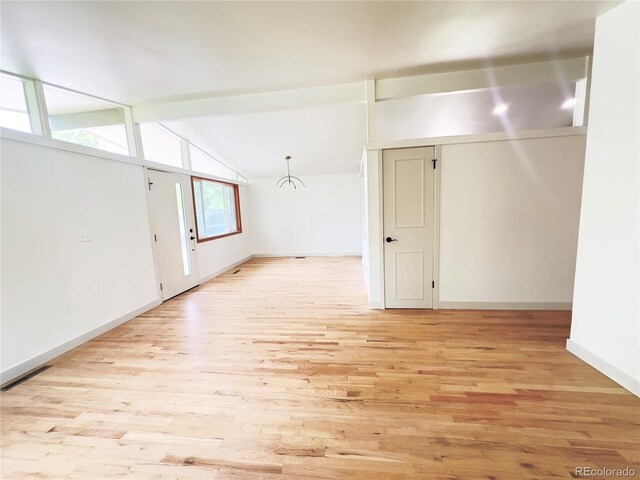 3355 Moorhead Ave, Boulder, CO 80305 - spare room featuring light wood-style flooring, baseboards, and lofted ceiling