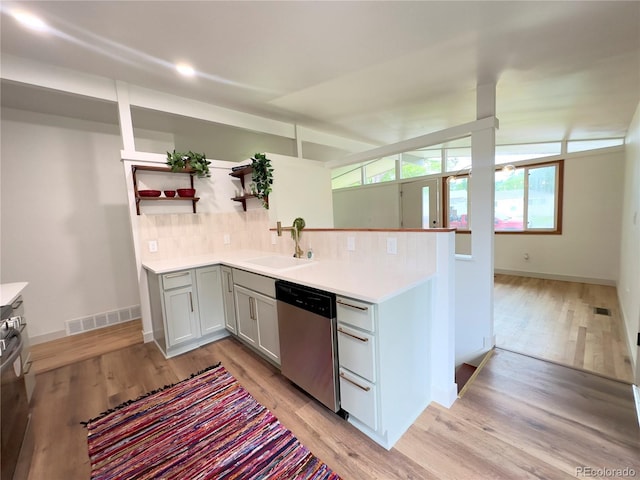 3355 Moorhead Ave, Boulder, CO 80305 - kitchen featuring stainless steel dishwasher, a sink, open shelves, decorative backsplash, and light wood-type flooring