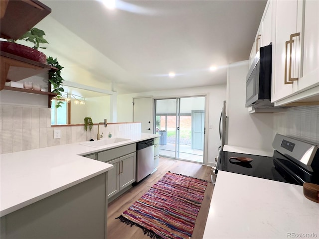 3355 Moorhead Ave, Boulder, CO 80305 - kitchen with appliances with stainless steel finishes, a sink, light wood-style floors, and light countertops