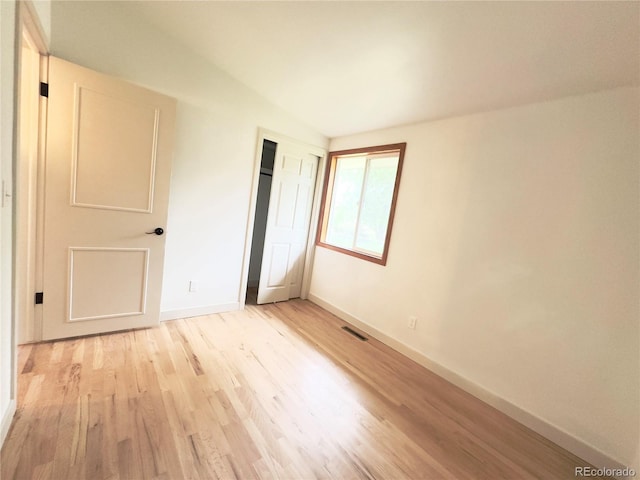 3355 Moorhead Ave, Boulder, CO 80305 - unfurnished bedroom featuring light wood finished floors, baseboards, and a closet