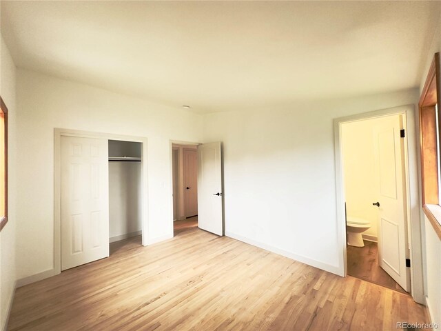 3355 Moorhead Ave, Boulder, CO 80305 - unfurnished bedroom featuring light wood finished floors, a closet, baseboards, and ensuite bathroom