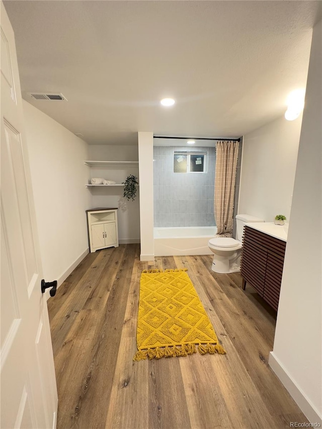 3355 Moorhead Ave, Boulder, CO 80305 - bathroom featuring toilet, shower / tub combo with curtain, wood finished floors, vanity, and baseboards