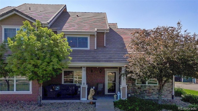 10449 Paris St Unit 207, Commerce City, CO 80640 - view of front facade featuring a tile roof