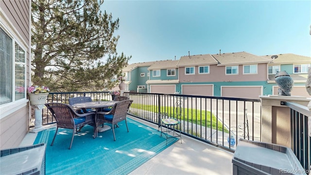 10449 Paris St Unit 207, Commerce City, CO 80640 - balcony featuring a residential view and outdoor dining space