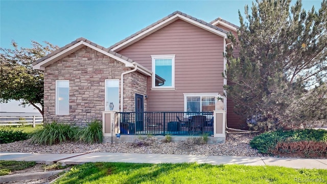 10449 Paris St Unit 207, Commerce City, CO 80640 - view of front of property with stone siding