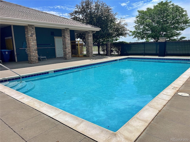 10449 Paris St Unit 207, Commerce City, CO 80640 - view of swimming pool with a patio