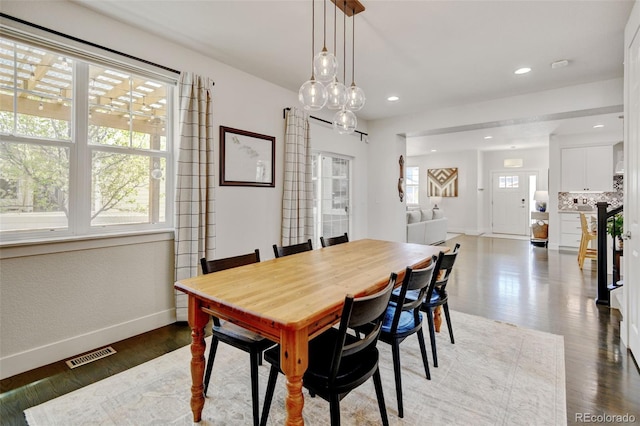 dining room featuring visible vents, recessed lighting, baseboards, and wood finished floors