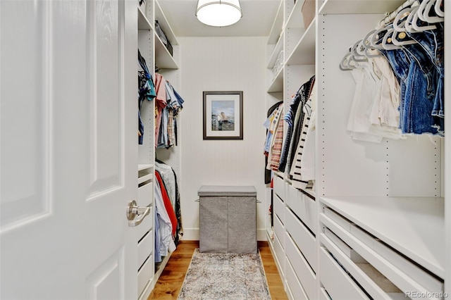 spacious closet featuring light wood-style flooring
