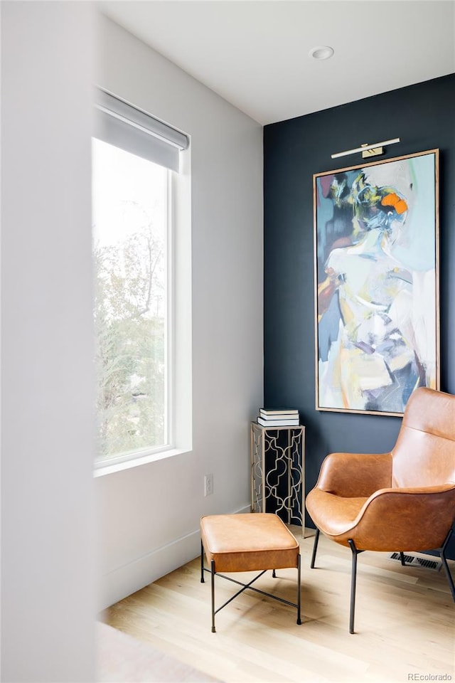 sitting room featuring light hardwood / wood-style floors