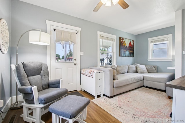 130 N 8th Ave, Brighton, CO 80601 - living area with healthy amount of natural light, wood finished floors, and a ceiling fan