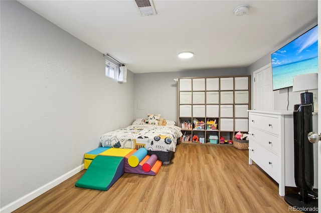 130 N 8th Ave, Brighton, CO 80601 - bedroom featuring wood finished floors and baseboards