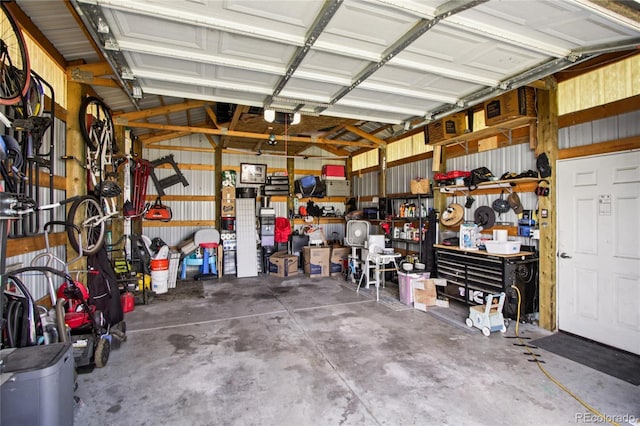 130 N 8th Ave, Brighton, CO 80601 - garage with a garage door opener and a workshop area