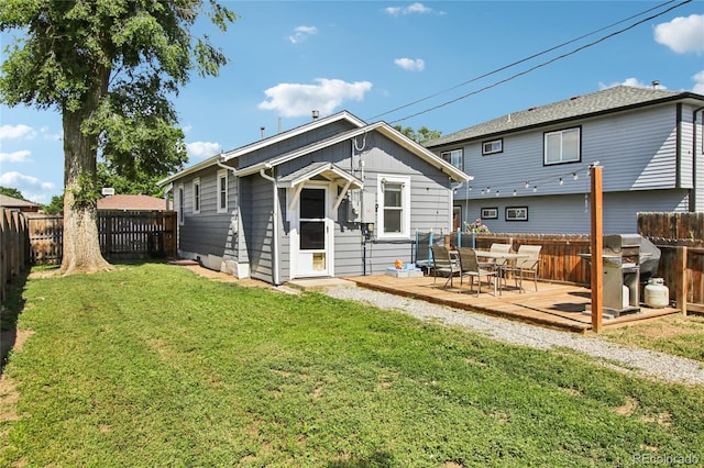 130 N 8th Ave, Brighton, CO 80601 - back of house with a wooden deck and a fenced backyard