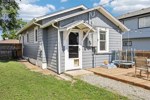 130 N 8th Ave, Brighton, CO 80601 - rear view of property featuring a deck and board and batten siding