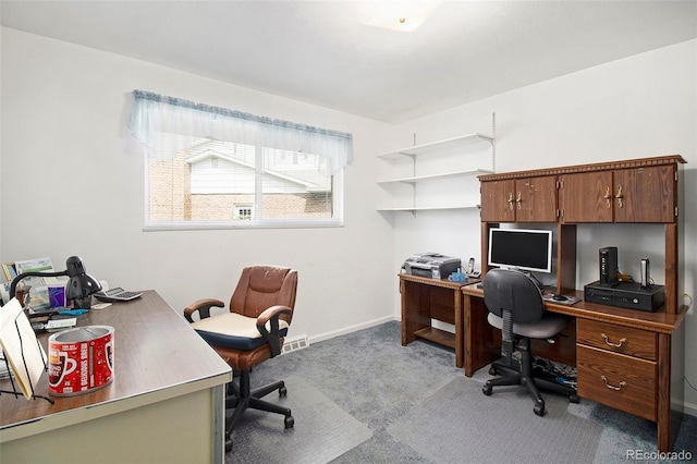 office with baseboards, visible vents, and light colored carpet