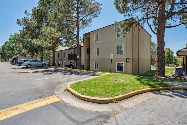 9700 E Iliff Ave Unit A3, Denver, CO 80231 - view of building exterior with uncovered parking
