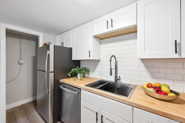 9700 E Iliff Ave Unit A3, Denver, CO 80231 - kitchen featuring appliances with stainless steel finishes, wood counters, white cabinetry, and dark wood-style floors