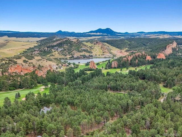 mountain view with a nearby body of water and a local golf course