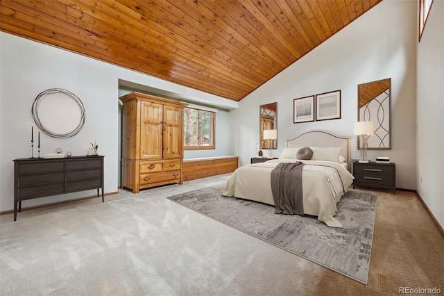 bedroom with lofted ceiling, carpet floors, wooden ceiling, and baseboards