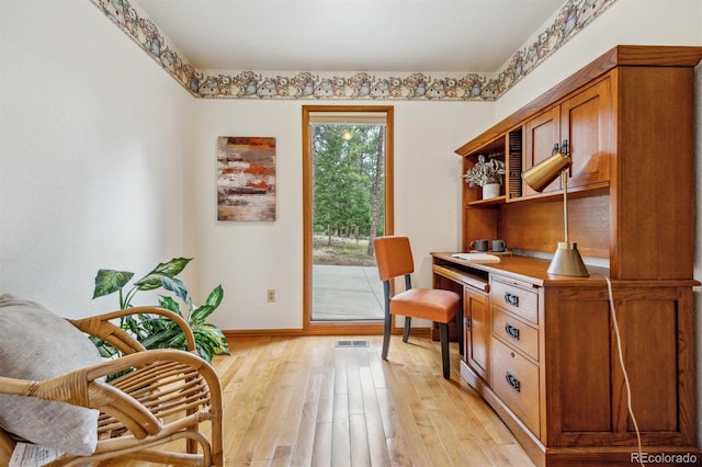 sitting room with light wood-style flooring and baseboards