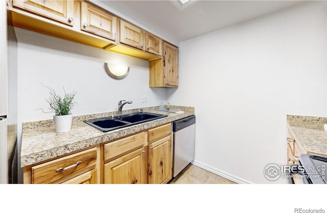 kitchen featuring tile countertops, light tile patterned floors, a sink, dishwasher, and baseboards