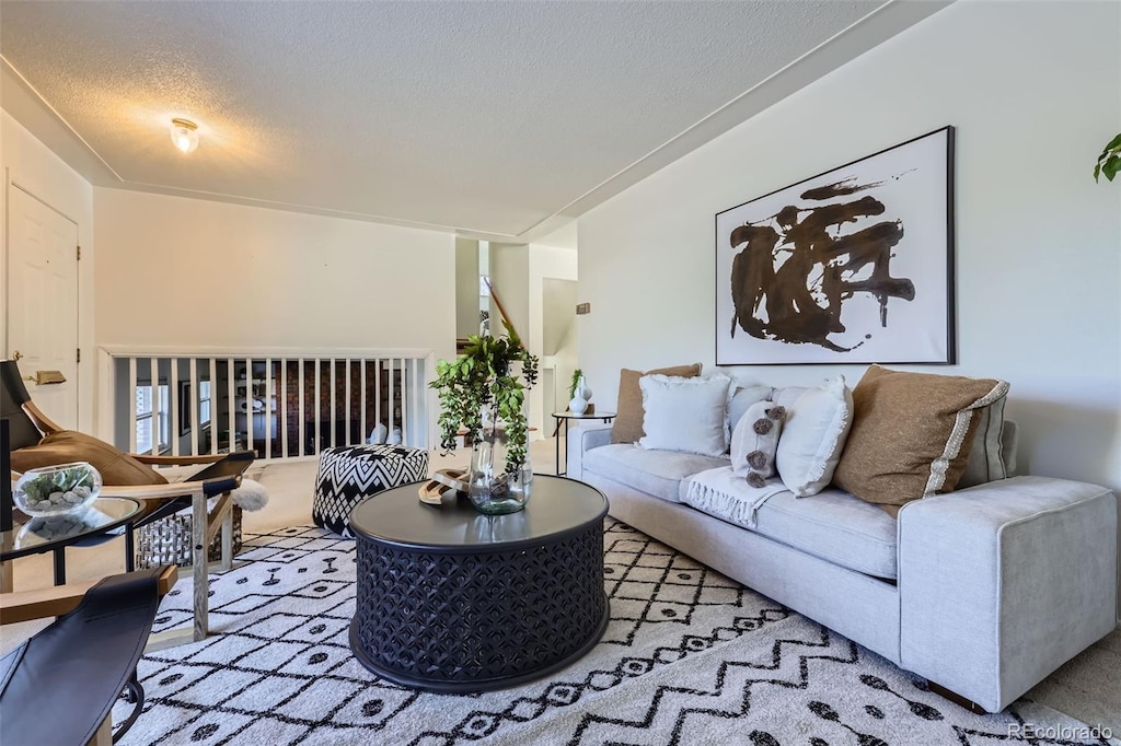 living room featuring a textured ceiling