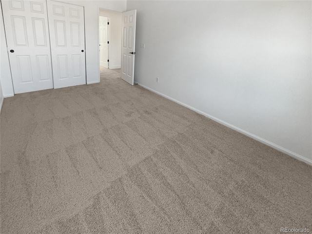 4735 S Cathay Ct, Aurora, CO 80015 - unfurnished bedroom featuring carpet floors and a closet