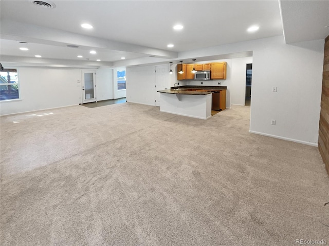 4735 S Cathay Ct, Aurora, CO 80015 - unfurnished living room with recessed lighting and light colored carpet