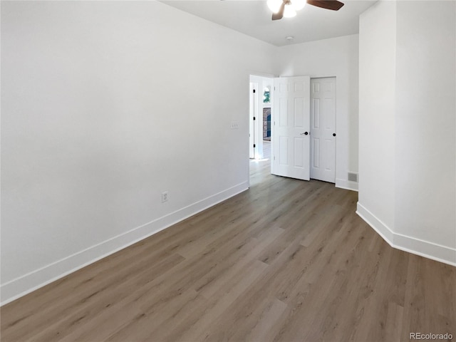 4735 S Cathay Ct, Aurora, CO 80015 - unfurnished bedroom featuring wood finished floors, a ceiling fan, and a closet
