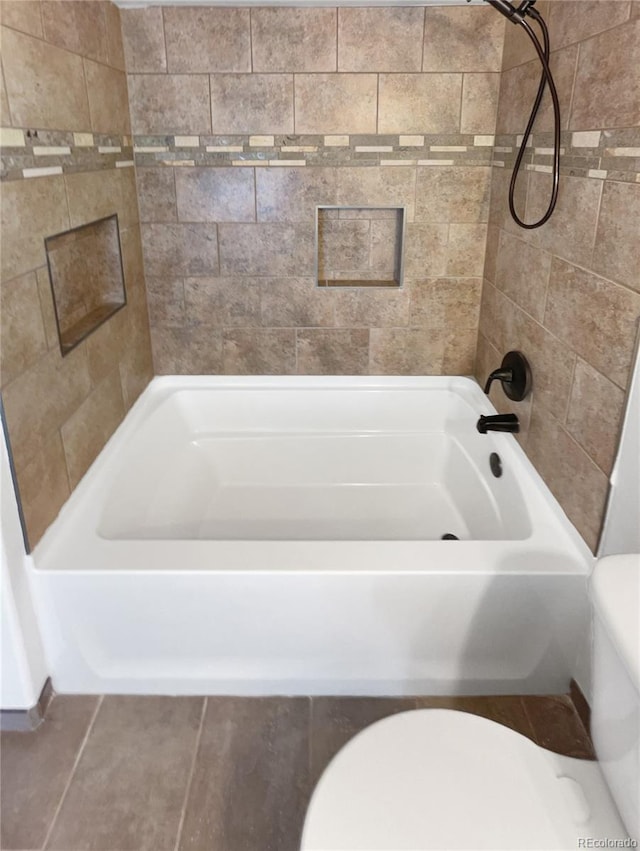 4735 S Cathay Ct, Aurora, CO 80015 - bathroom featuring toilet and shower / bathtub combination
