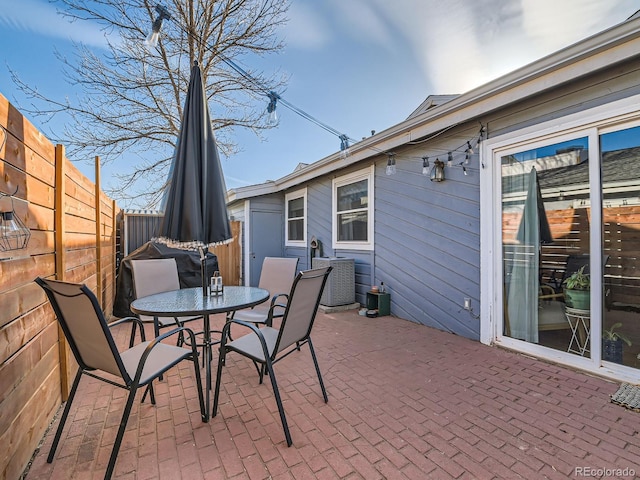 view of patio featuring outdoor dining space and a fenced backyard