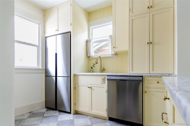 kitchen featuring appliances with stainless steel finishes, sink, and plenty of natural light