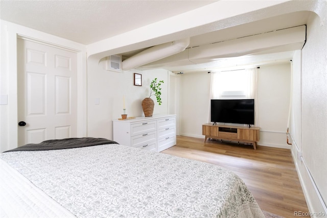 bedroom featuring light wood-type flooring