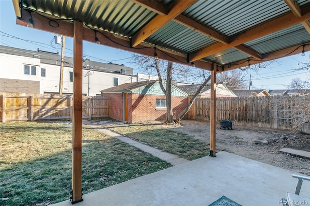 view of yard with an outbuilding and a patio area