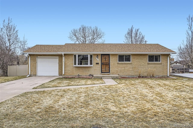 ranch-style house featuring an attached garage, brick siding, fence, driveway, and a front yard