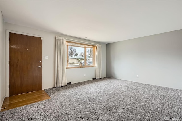 empty room with carpet flooring