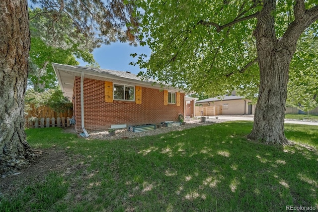 rear view of house with a lawn