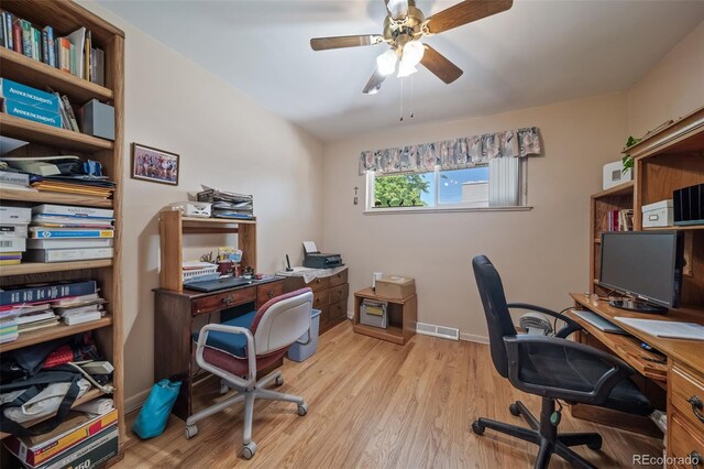 office with ceiling fan and light wood-type flooring